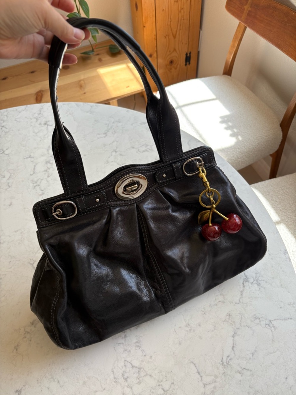 Coach Black Leather Shoulder Bag with Red Cherry Charm
